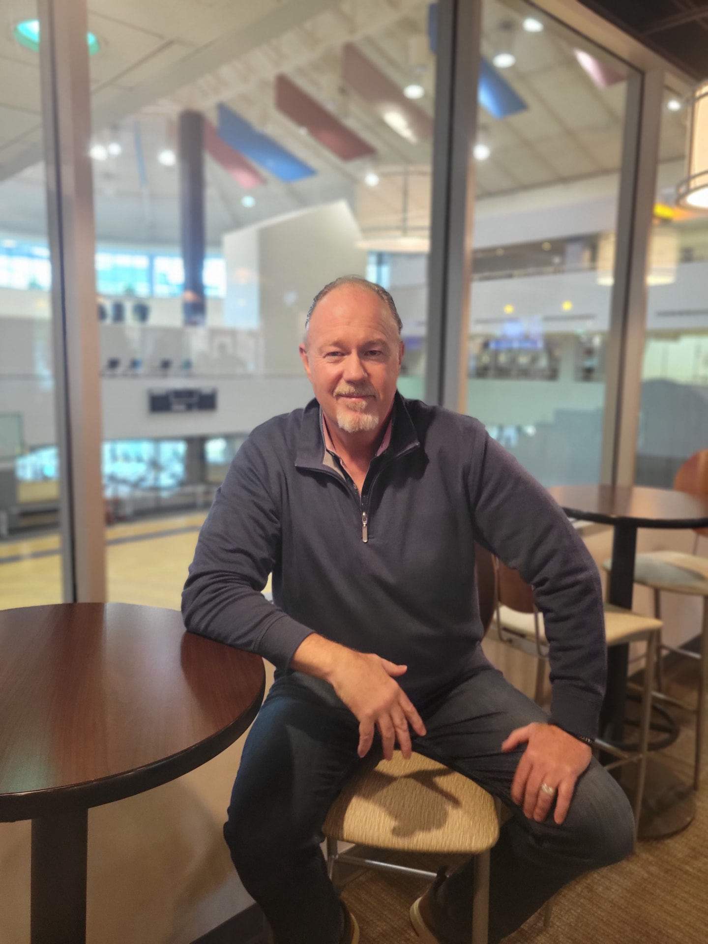 Neil Doherty in a warm, professional coaching setting